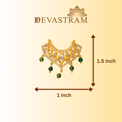 Gold necklace with green stones on a beige background