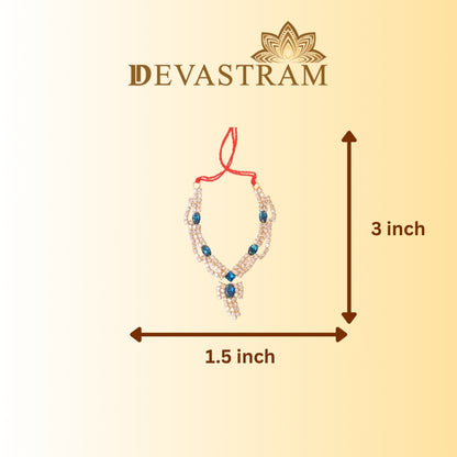 Blue Ad necklace with measurements on a beige background
