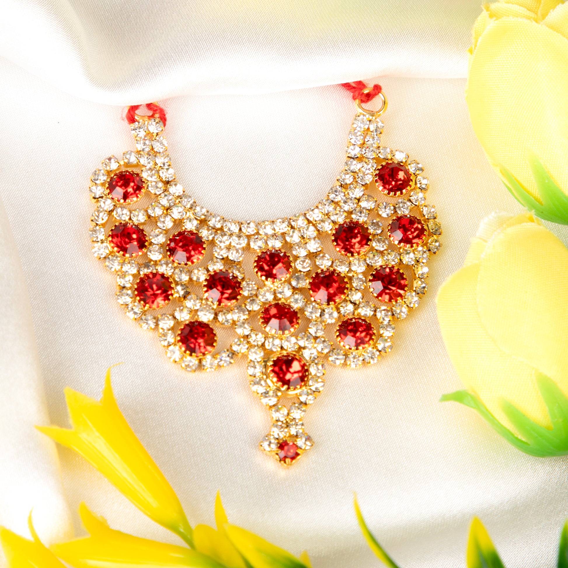Gold necklace with red gemstones 