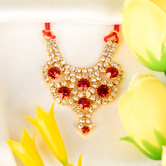 Laddu Gopal necklace with red and gold stones on a white background with yellow flowers.